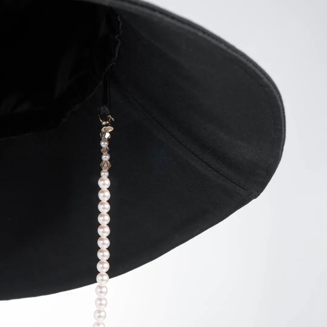 Panama hat with a pearl chain