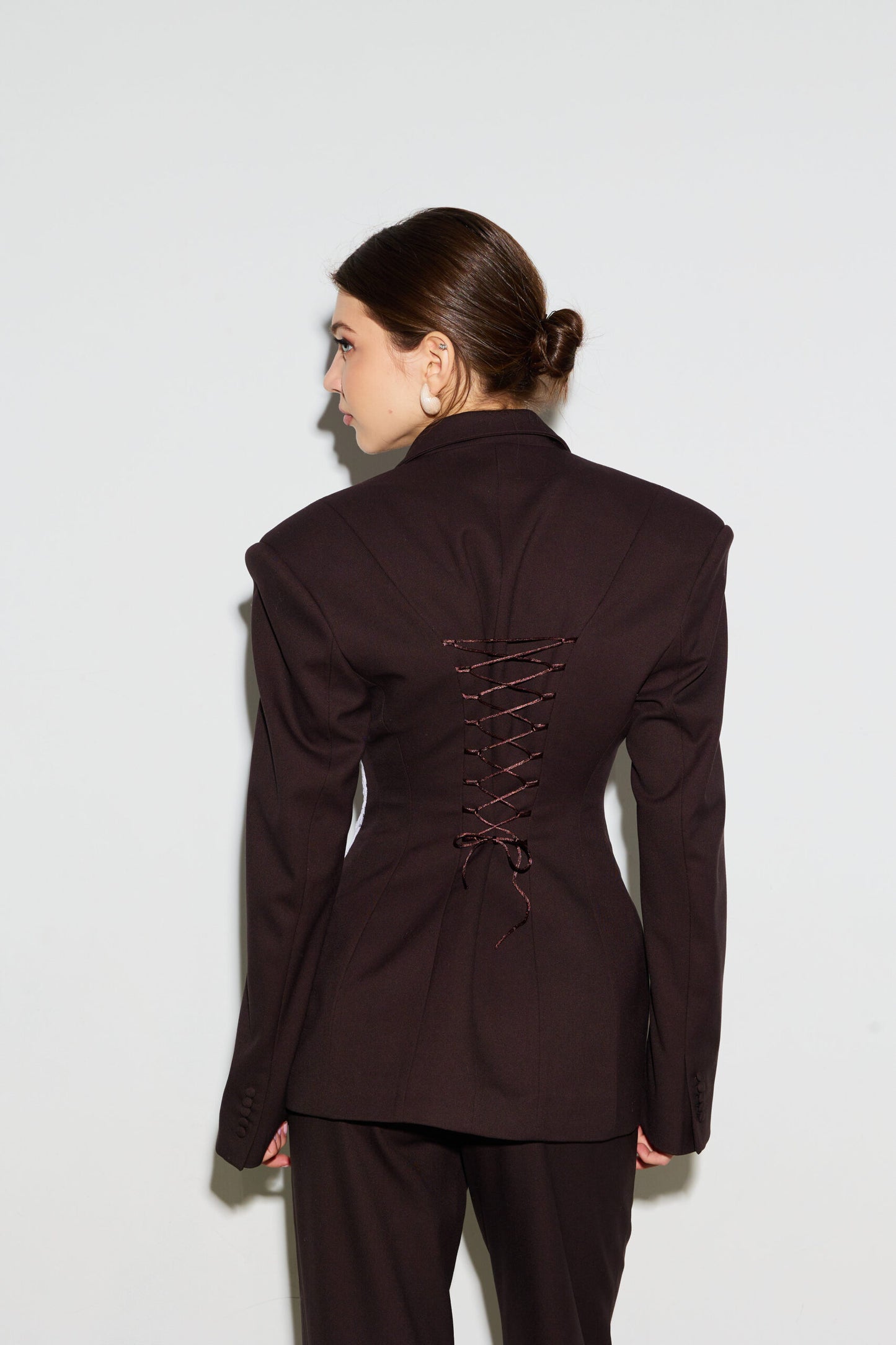 Jacket embellished with chocolate lace corset