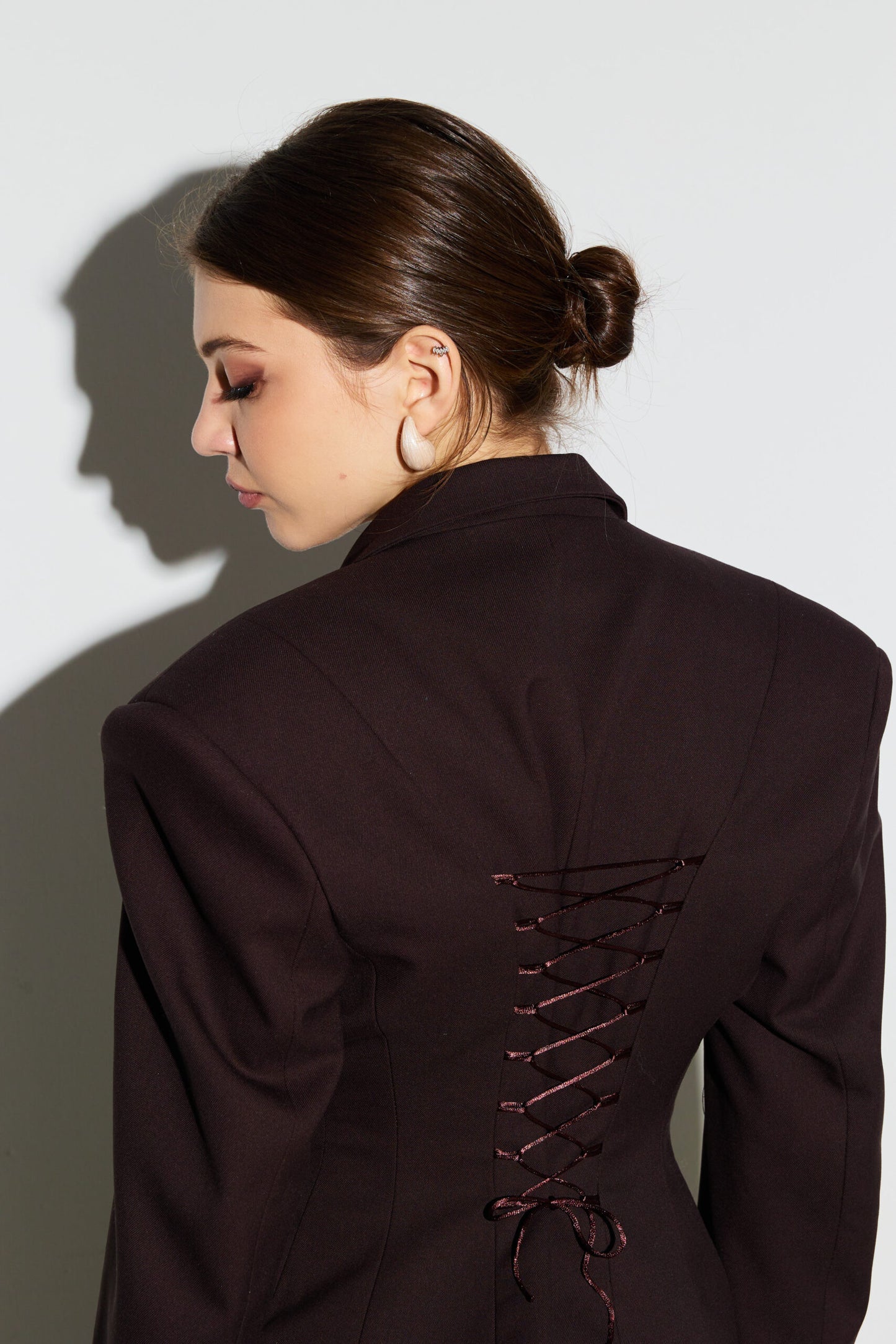 Jacket embellished with chocolate lace corset