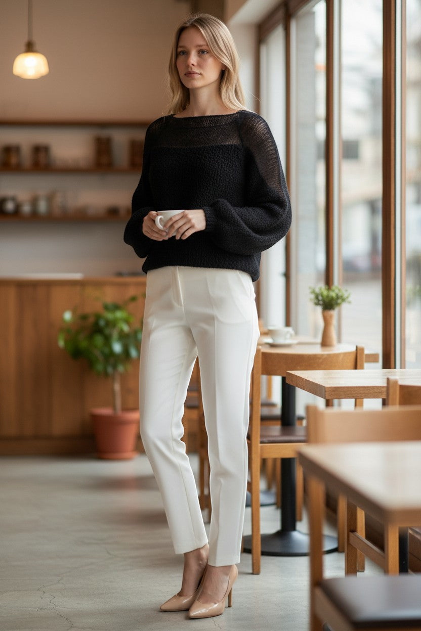 Stassia 12 black wool and mohair blend sweater with sheer neckline and balloon sleeves.