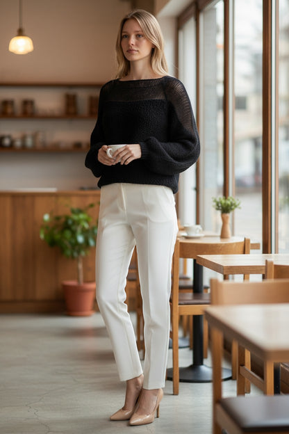 Stassia 12 black wool and mohair blend sweater with sheer neckline and balloon sleeves.